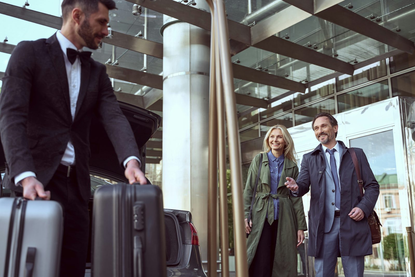 Couple and driver at airport